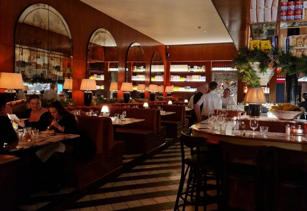 Cosy bar interior with booth tables and a marble bar top